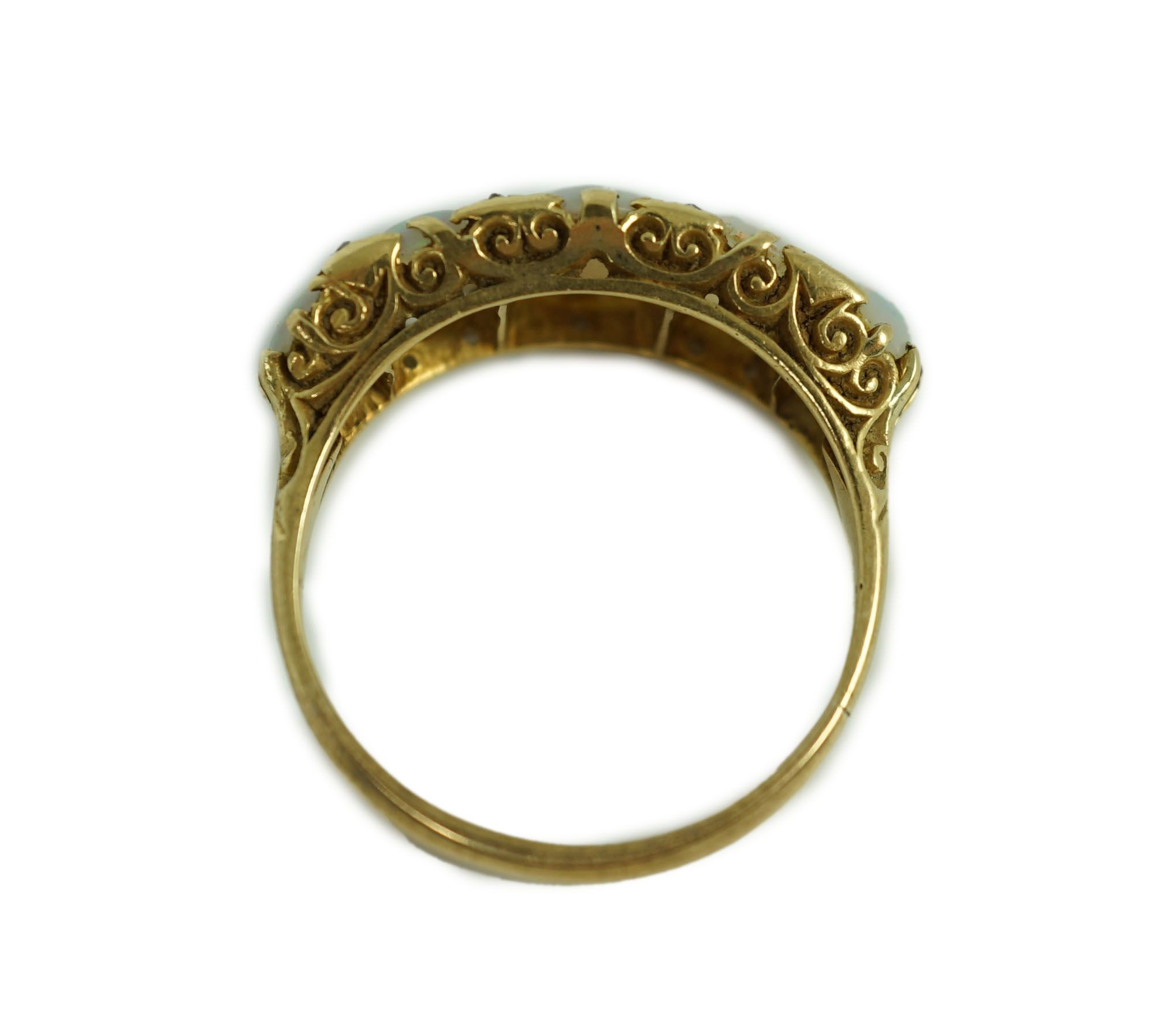 An 18ct gold and graduated five stone opal half hoop ring, with diamond chip spacers